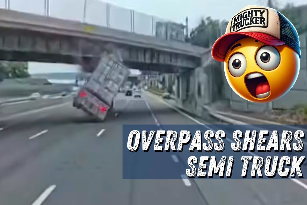 Watch: Semi Slams Into Overpass and Flips Onto Its Side